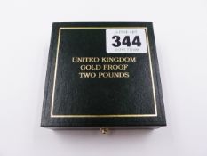 A UNITED KINGDON CASED GOLD PROOF TWO POUND COIN DATED 1997.