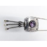A 900 STAMPED CONTINENTAL WHITE METAL ARTS AND CRAFT STYLE AMETHYST AND PEARL PENDANT. APPROXIMATE