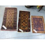 THREE ANTIQUE BELOUCH MATS. (3)