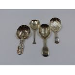 THREE SILVER HALLMARKED AND ONE WHITE METAL CADDY SPOON OF VARIOUS STYLES AND DATES TO INCLUDE A