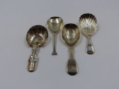 THREE SILVER HALLMARKED AND ONE WHITE METAL CADDY SPOON OF VARIOUS STYLES AND DATES TO INCLUDE A