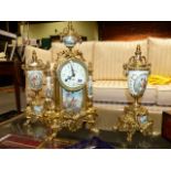 A 19th.C.FRENCH STYLE GILT BRASS CLOCK GARNITURE WITH DECORATED PORCELAIN PANELS.