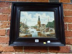 A CONTINENTAL DELFT POTTERY PLAQUE DECORATED WITH A CANAL SCENE. 28 x 36cms.