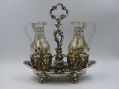 A WHITE METAAL FRENCH OIL AND VINEGAR STAND FITTED WITH TWO CRUETS, MAKER ALPHONSE DEBAIN.