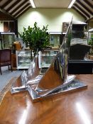 A SET OF THREE GRADUATED ART DECO STYLE CAST ALLOY SAILING BOATS.