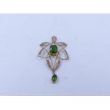 A 9ct STAMPED YELLOW GOLD SEED PEARL AND GREEN GEMSTONE ART NOUVEAU PENDANT. APPROXIMATE