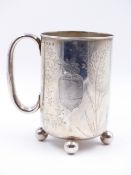 A VICTORIAN SILVER FOOTED MUG DATED 1882, TOWN MARK BIRMINGHAM. ENGRAVED WITH A DESIGN OF VEGETABLES