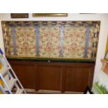 A LARGE 19th.C.OAK AND POLYCHROME DECORATED PANEL INSET WITH ARTS AND CRAFTS STYLE FABRIC PANEL OVER