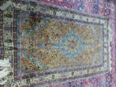 A PERSIAN TABRIZ RUG. 236 x 139cms.