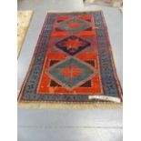 AN ANTIQUE CAUCASIAN TRIBAL RUG. 188 x 118cms.