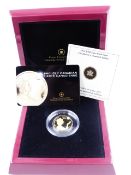 A 2012 $300 PURE GOLD PROOF COIN, THE QUEEN'S DIAMOND JUBILEE. THE COIN IS SET WITH A CANADIAN MAPLE