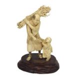 Chinese Okimono Figural Group with young child wood collector with basket on his shoulders, on