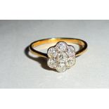 Ladies 18ct Gold Diamond Cluster Ring, central collet set diamond surrounded by 6 matched