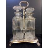 C19th Silver Plated 4 Bottle Spirit Tantalus with labels Rum, Gin, Whisky & Brandy, decanters star