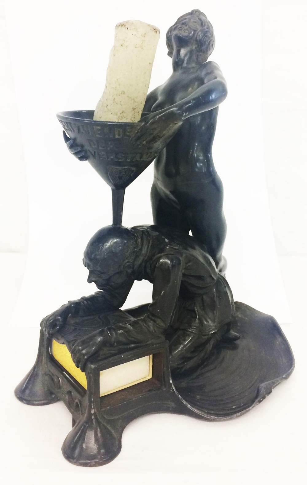 Early C20th German Spelter Candle/Match Holder modelled as gentleman kneeling on lily pad over a