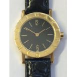 Bulgari (Bvlgari) 18ct. Gold Wrist Watch, black face, bar & Arabic numerals, quartz movement A5011