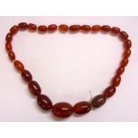 Amber Graduated Bead Necklace with split bead screw fitting, 27 beads + catch, approx. 19 1/2" L,