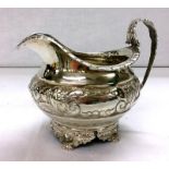 George IV Regency Style Silver Milk Jug, foot raised on 4 animal paw supports with flower & leaf
