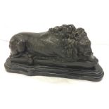 French Patinated Bronze Recumbent Lion on shaped marble base, marked Bonheur Paris