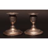 Pair of Edward VII dwarf silver candlesticks of typical circular form, Birmingham 1907, maker EJG (