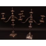 Pair of electro-plated two-branch candelabra, moulded with foliage, scrolls etc, 21" high