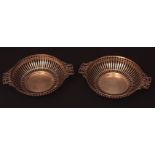 Pair of Edward VII two-handled silver bon-bon dishes with pierced surrounds (lacking liners),