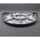 Booth's Arcadia seven-sectional hors d'oeuvres set supported in an oval wooden tray with two side