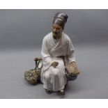 20th century Oriental seated figure of a doctor, 10" tall