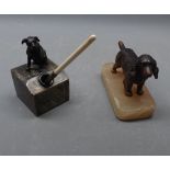 Painted spelter model of a spaniel on an agate base, together with an inkwell modelled as a bronze