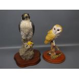 Wild Track figure: barn owl on a post, together with a further figure of a bird of prey on a rock on