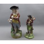 Two 18th century Staffordshire models of a shepherd and his lamb on a foliage base, and a hearty