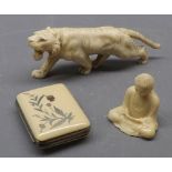 Japanese ivory model of a lion together with a further inlaid composition purse with floral