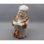 19th century novelty Continental biscuit storage jar modelled as a gent reading the Times newspaper,