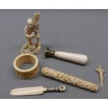 Group of six ivory items to include a bodkin case, a small crucifix, a miniature cricket bat with