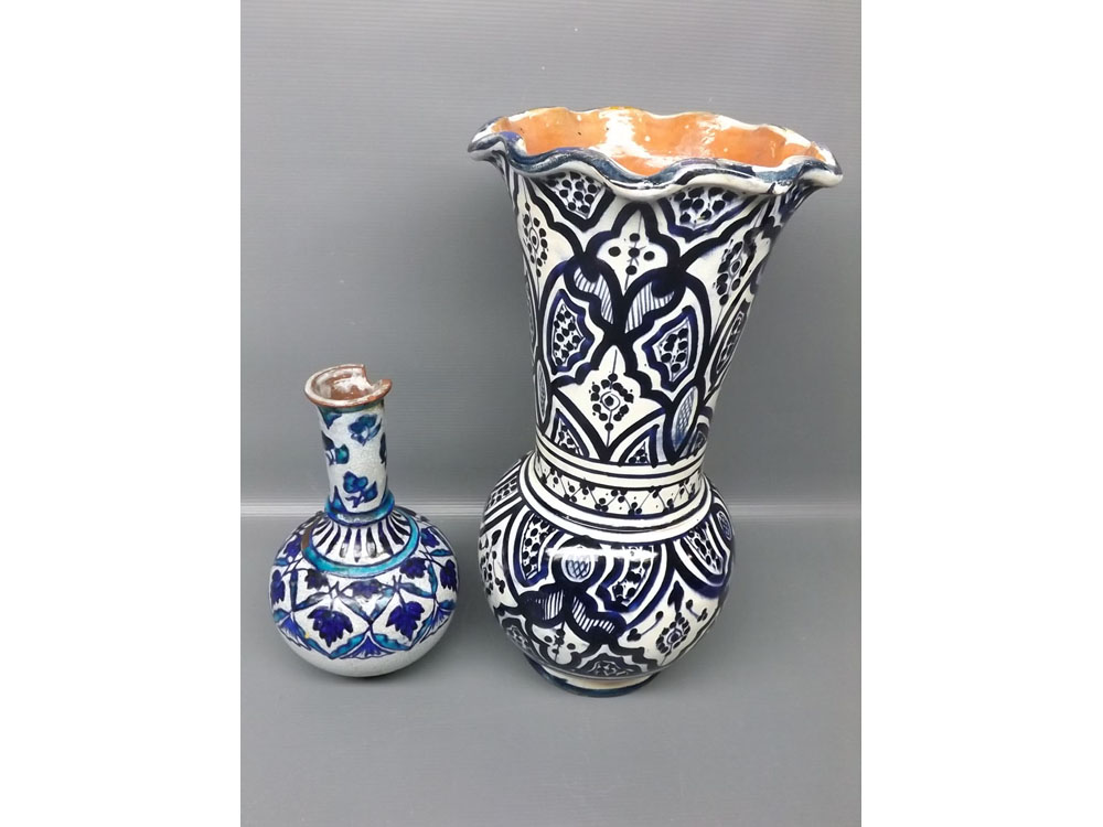 Small Iznick bulbous crackle glaze vase decorated with blue designs, together with a further