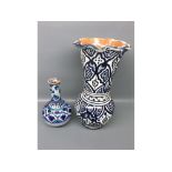 Small Iznick bulbous crackle glaze vase decorated with blue designs, together with a further