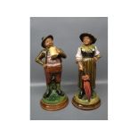 Pair of painted Austrian modelled figures of a lady and a gent, on circular plinth with impressed