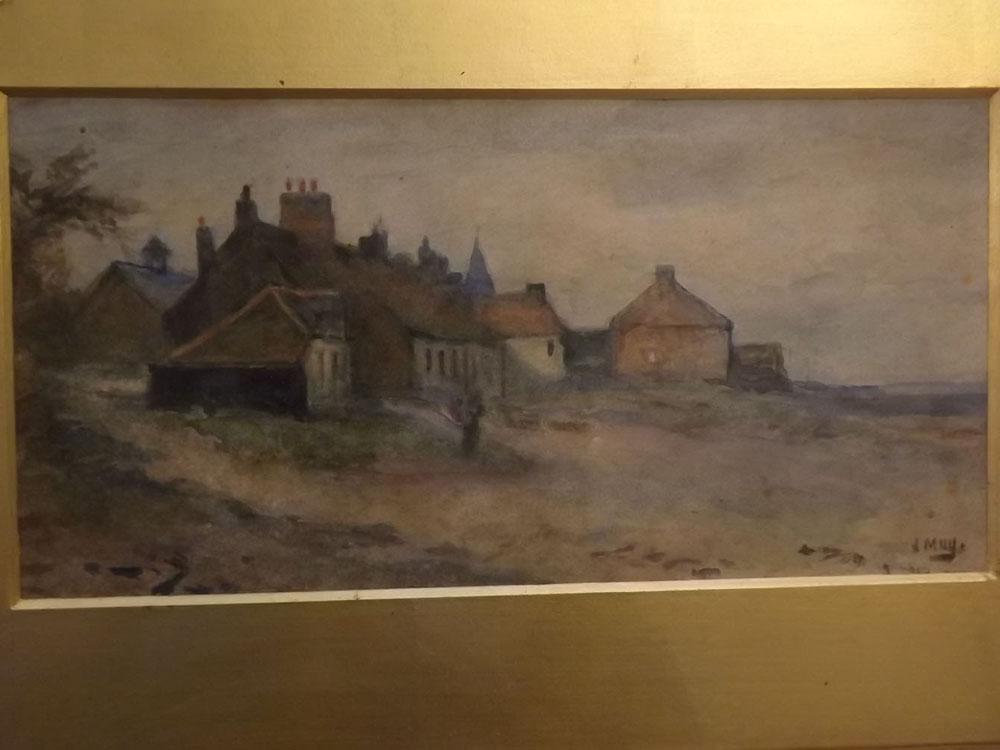 J May, signed, watercolour, Figure before a village, 5 x 10 ins