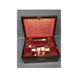 19th century rosewood and Ivorine inlaid embroidery box containing various implements, materials