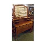 Early 20th century mahogany dressing table, with shaped and bevelled rectangular mirror on