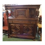 20th century Gothic carved court cupboard, fitted with central drawer with two bulbous column