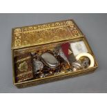 Vintage embossed brass rectangular box containing various necklaces, silver plated sovereign case,
