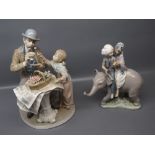 Two Lladro figures of seated dandy with a young girl and further group of two of a young Indian