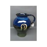20th century Studio pottery jug signed "Jack O'Patsy" decorated in blue and green design, shaped