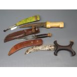 Two Eastern replica fighting knives and a further sheath knife (3)