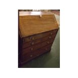 George III mahogany four drawer bureau, the crossbanded flap opening to reveal a fitted interior