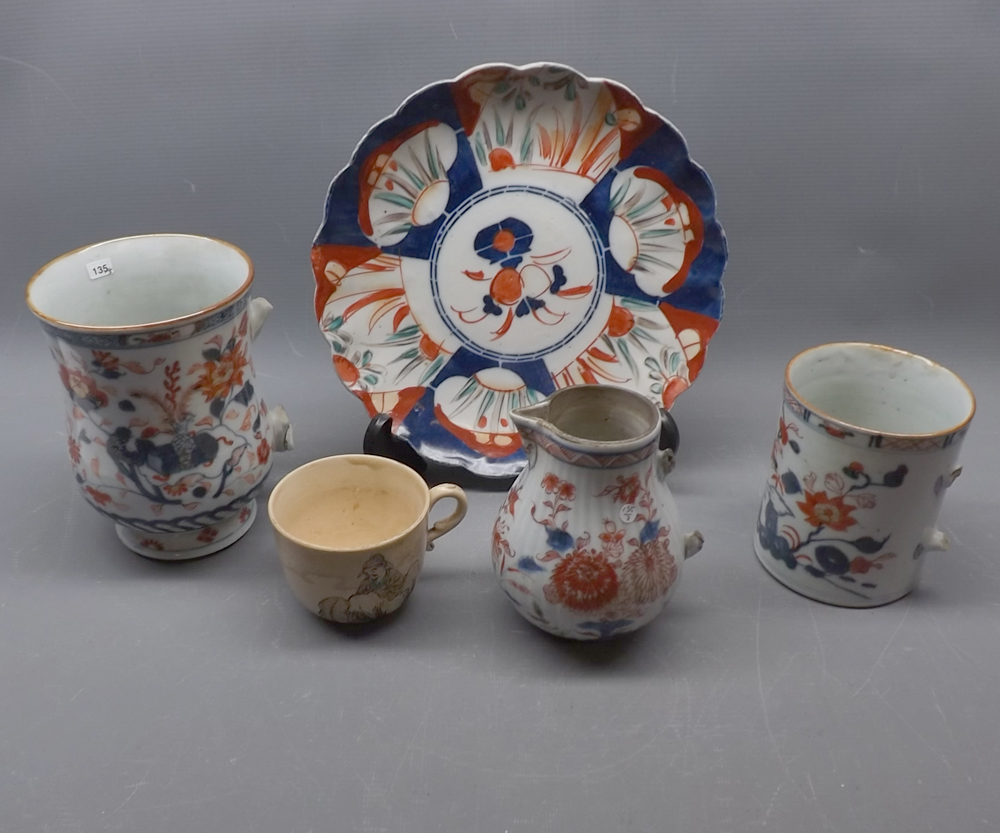 Imari decorated plate and a 19th century Imari coloured shaped mug with broken handle, together with