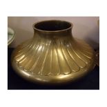 Heavy brass squat vase, with half-fluted decoration, 14 ins diameter and 8 ins high