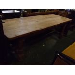 Modern waxed pine farmhouse kitchen table, on four heavy turned legs on an H-stretcher, 96 ins