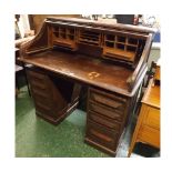 Early 20th century oak twin pedestal tambour fronted desk, with fitted pigeonhole interior, each